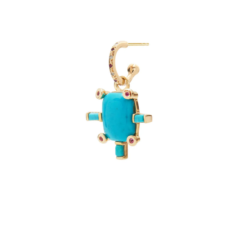 The Juno Charm with Turquoise by Scosha is a 14k gold earring featuring a turtle-shaped turquoise stone, pink gemstones, and turquoise accents on the head, legs, and tail, shown against a white background.