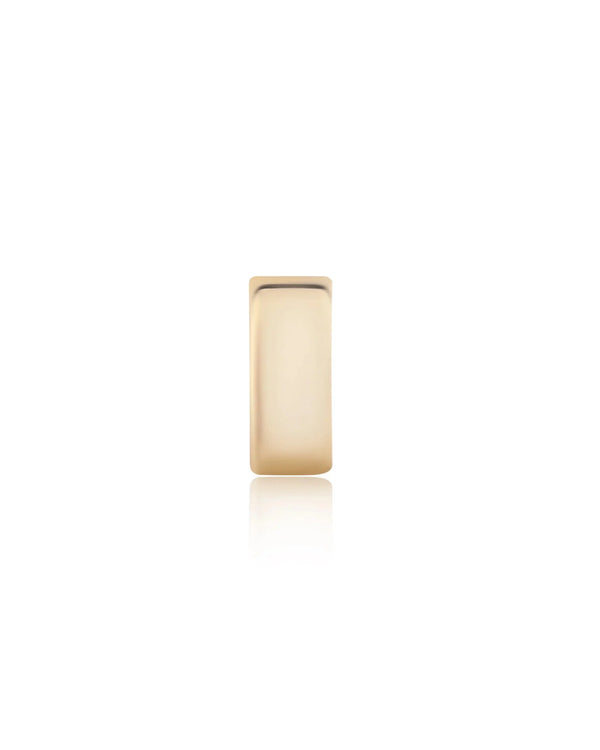 A single Rachel Reid Gold Wheel Charm with a smooth, polished finish is centered on a plain white background.
