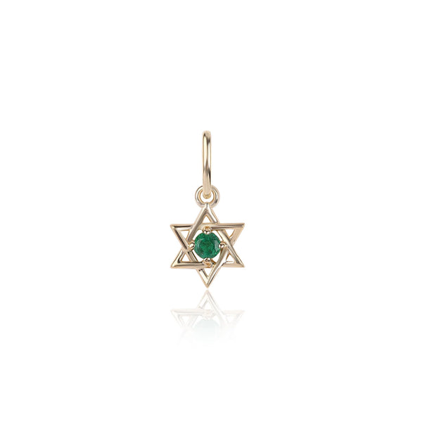 The Mini Jewish Star Charm by Rachel Reid is a gold Star of David pendant in 14K yellow gold with a central green gemstone, displayed on a white background.