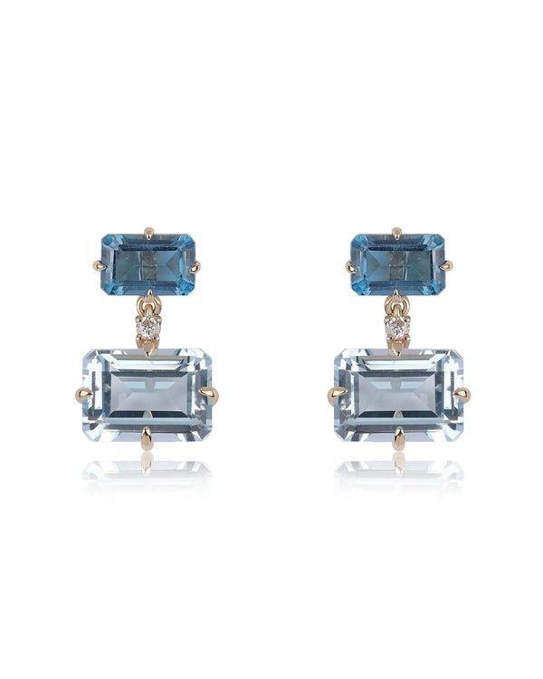 Rachel Reid’s Gemstone Drop Earrings feature rectangular blue gemstones set in 14K yellow gold, with a dark blue stone on top and a larger light blue drop below. Perfectly pair them with your favorite Gemstone Bead Necklace.