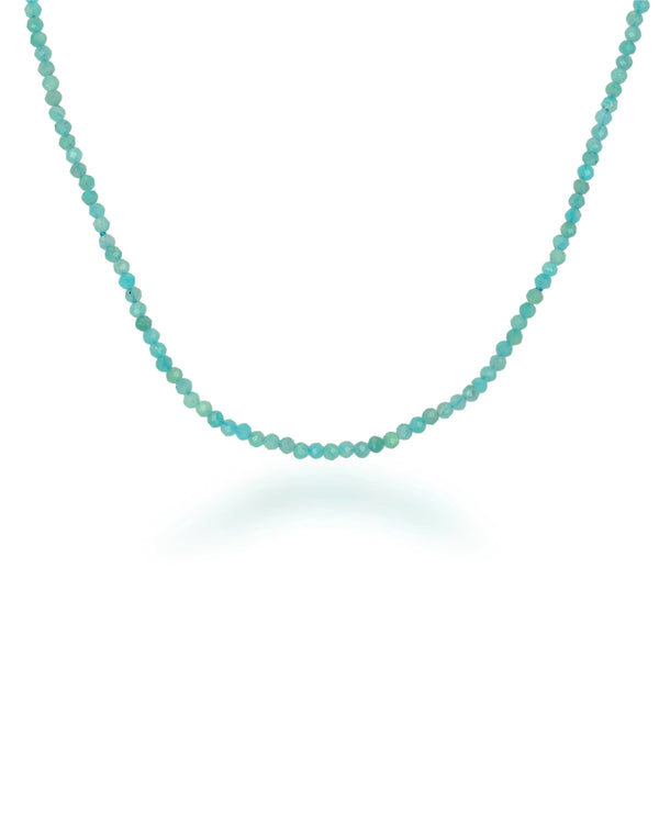 The Rachel Reid 28 Gemstone Bead Necklace features small, round turquoise beads in a simple strand, finished with a secure lobster claw closure and displayed on a white background.