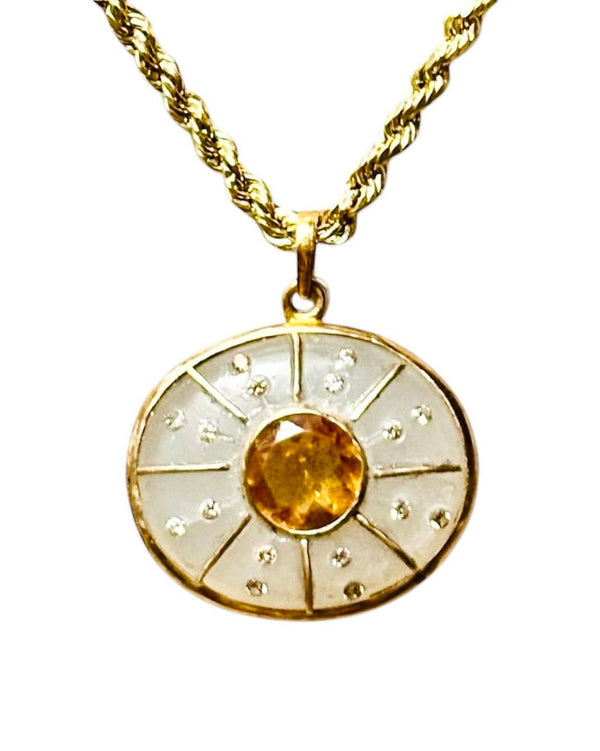 The Jen Proudman SOL Pendant features a gold rope chain with a round 14k gold pendant set with citrine, moonstone, and diamonds in a sunburst design.